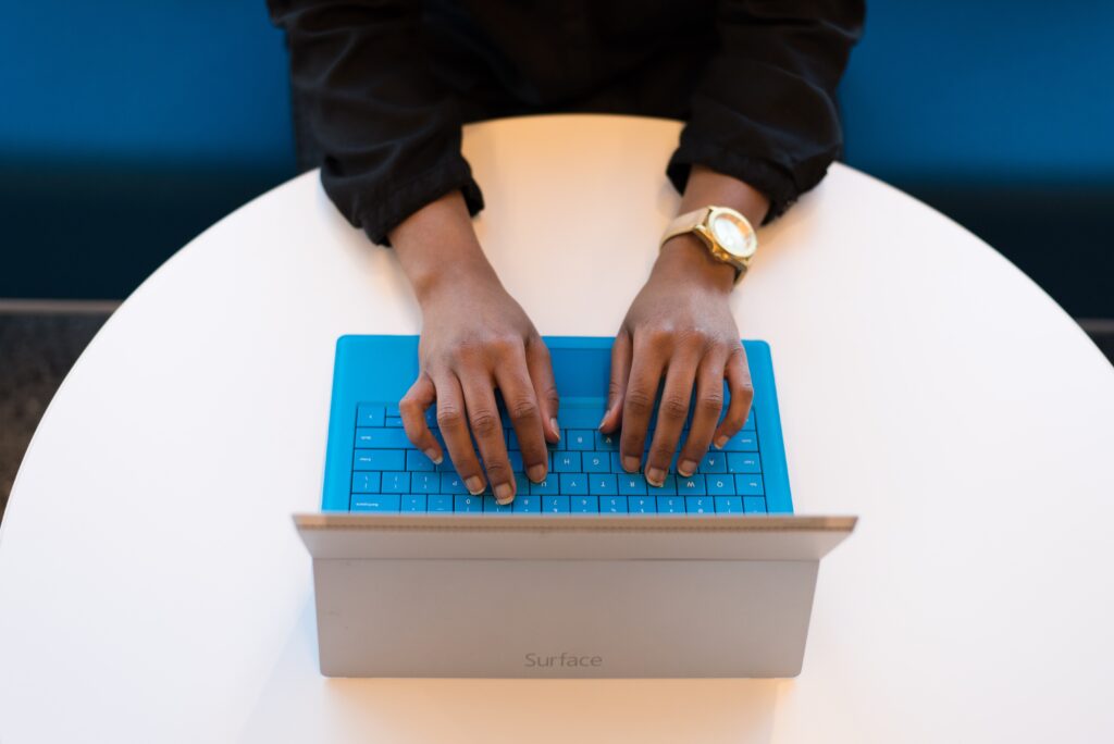 man typing on surface pro 3 laptop