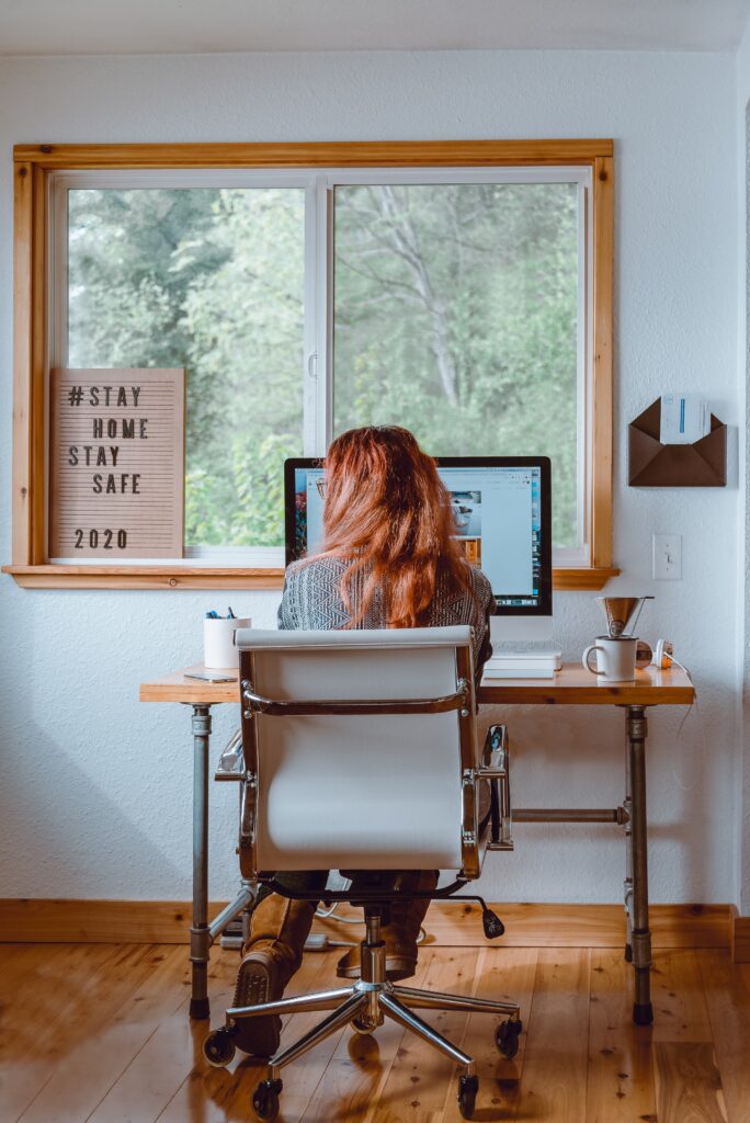 a person with long hair working from home