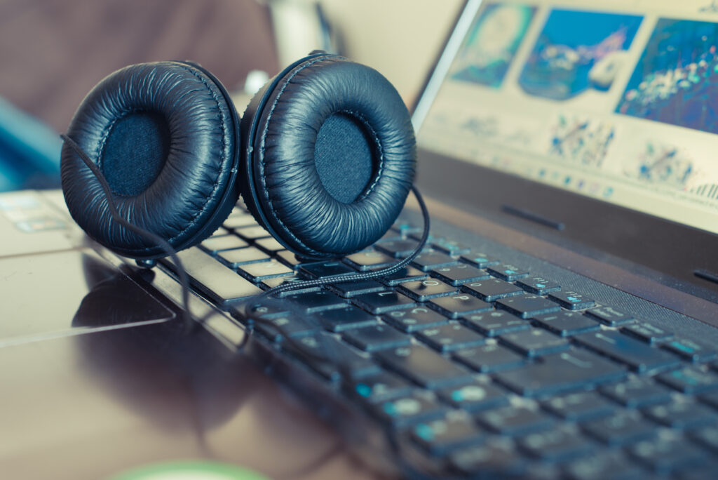 headphones sitting on laptop keyboard