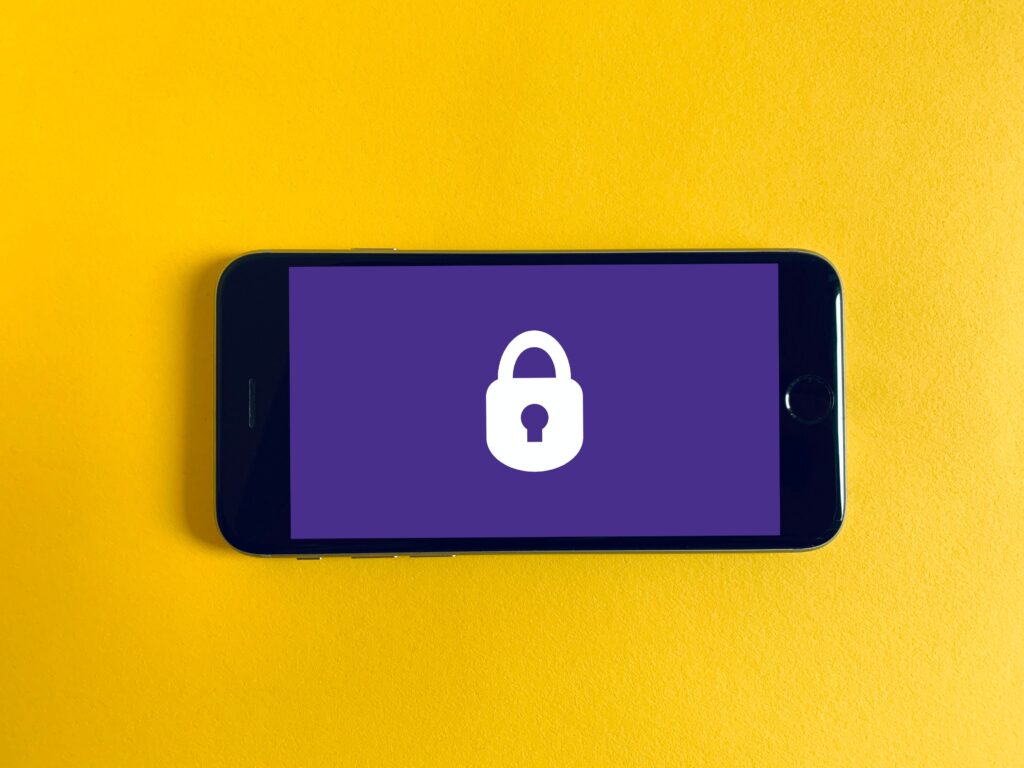 phone with lock on the screen against yellow background
