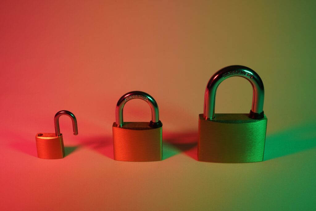 three locks lined up, with the one on the far left unlocked