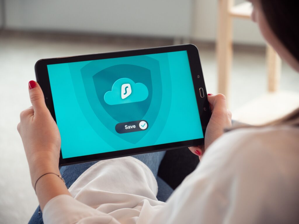 person on ipad showing secure vpn network on screen