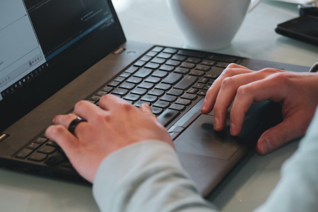 Person typing on laptop