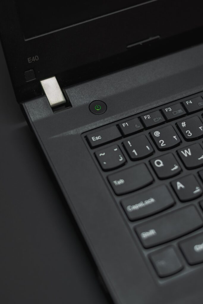 Close up of black laptop's power button