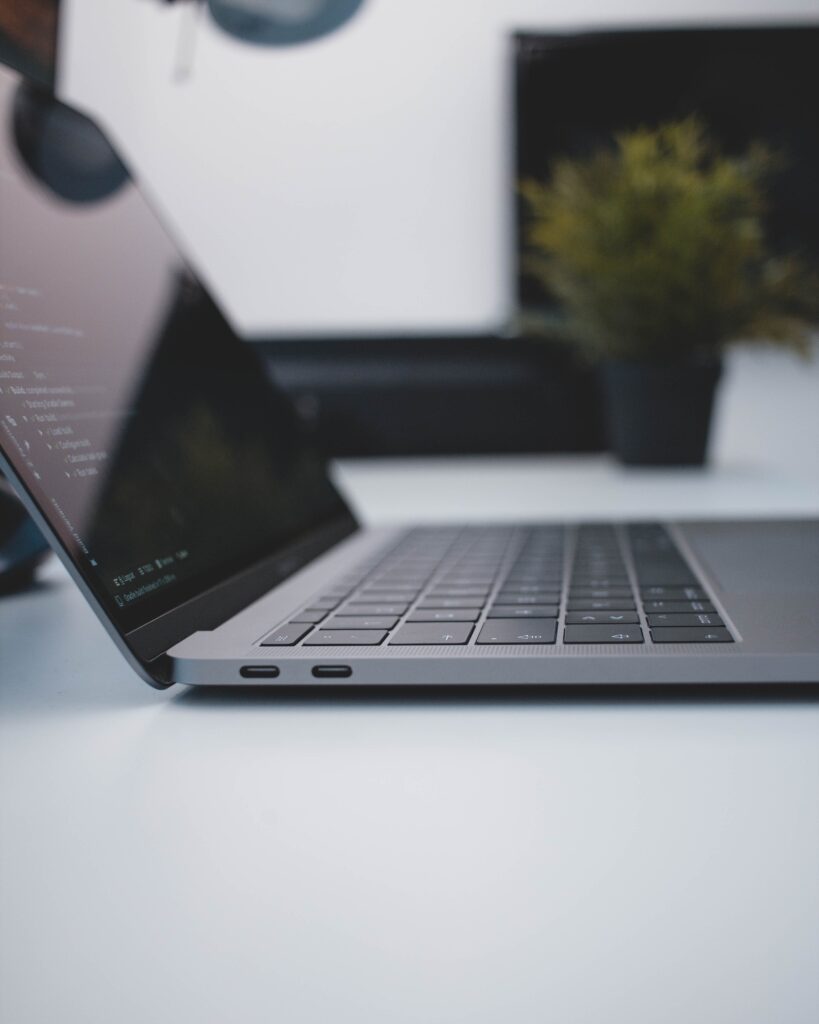 Side view of laptop sitting on desk