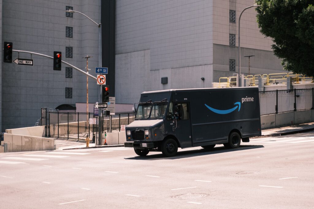 Amazon delivery truck driving through an intersection