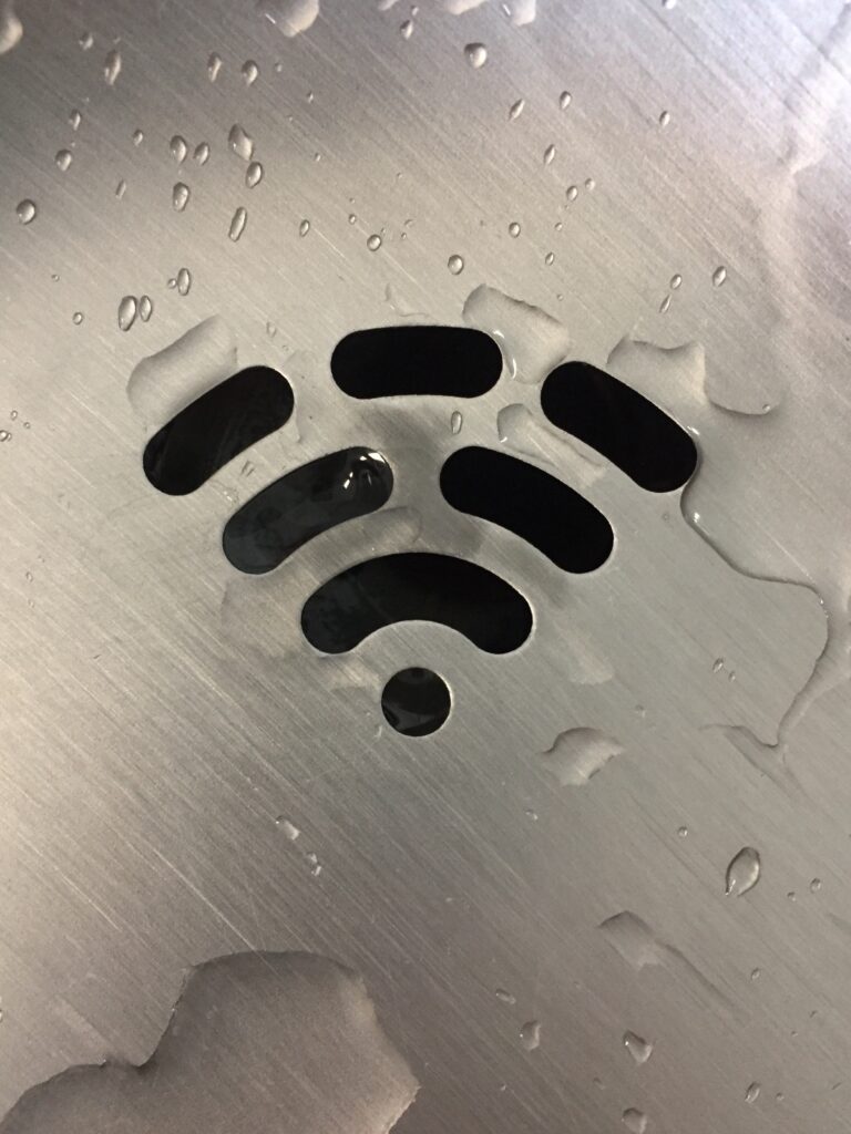 Metal with the wifi symbol carved out