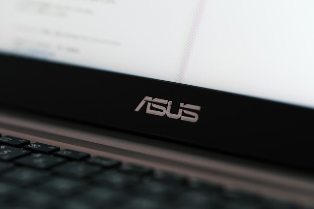 Close up view of ASUS logo on laptop computer