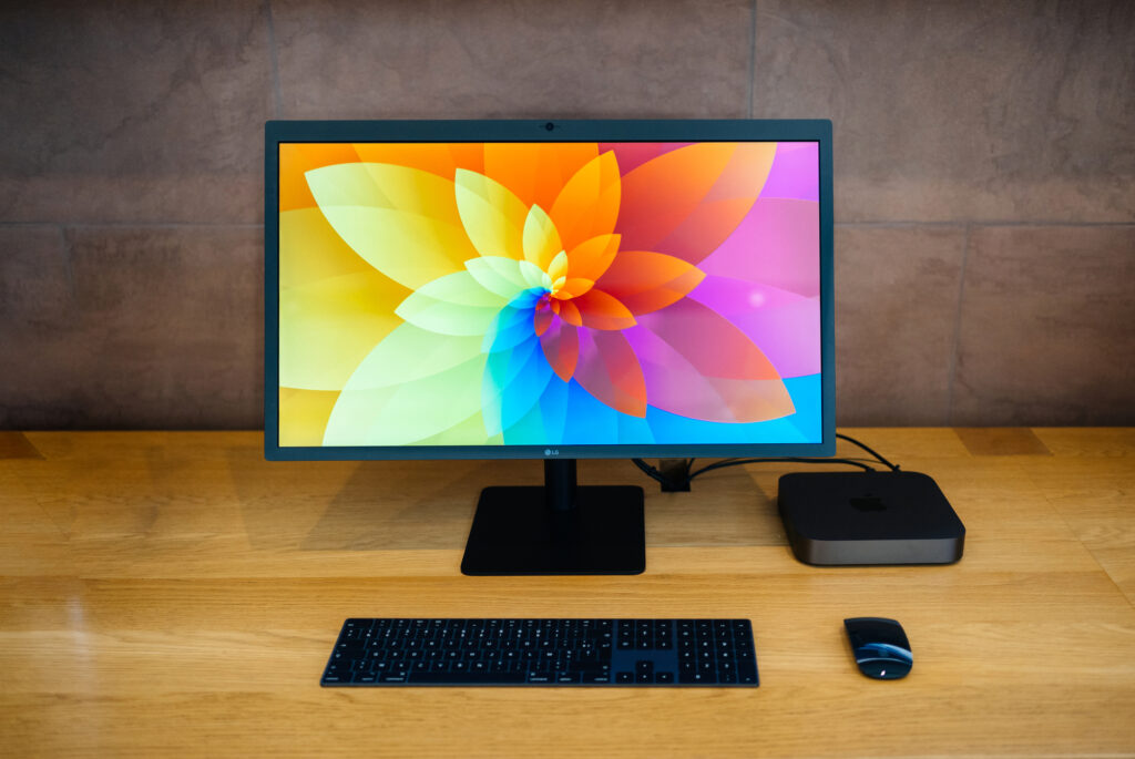 LG computer sitting on desktop with bright colored display screen.