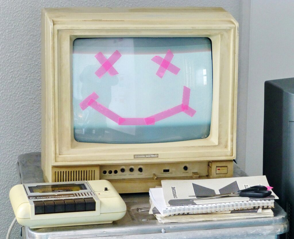 Old computer with face on the screen